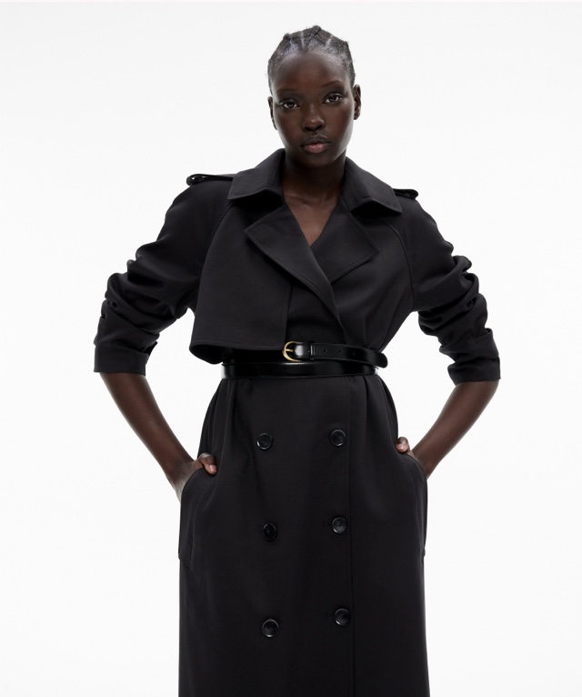 Woman in a black trench coat