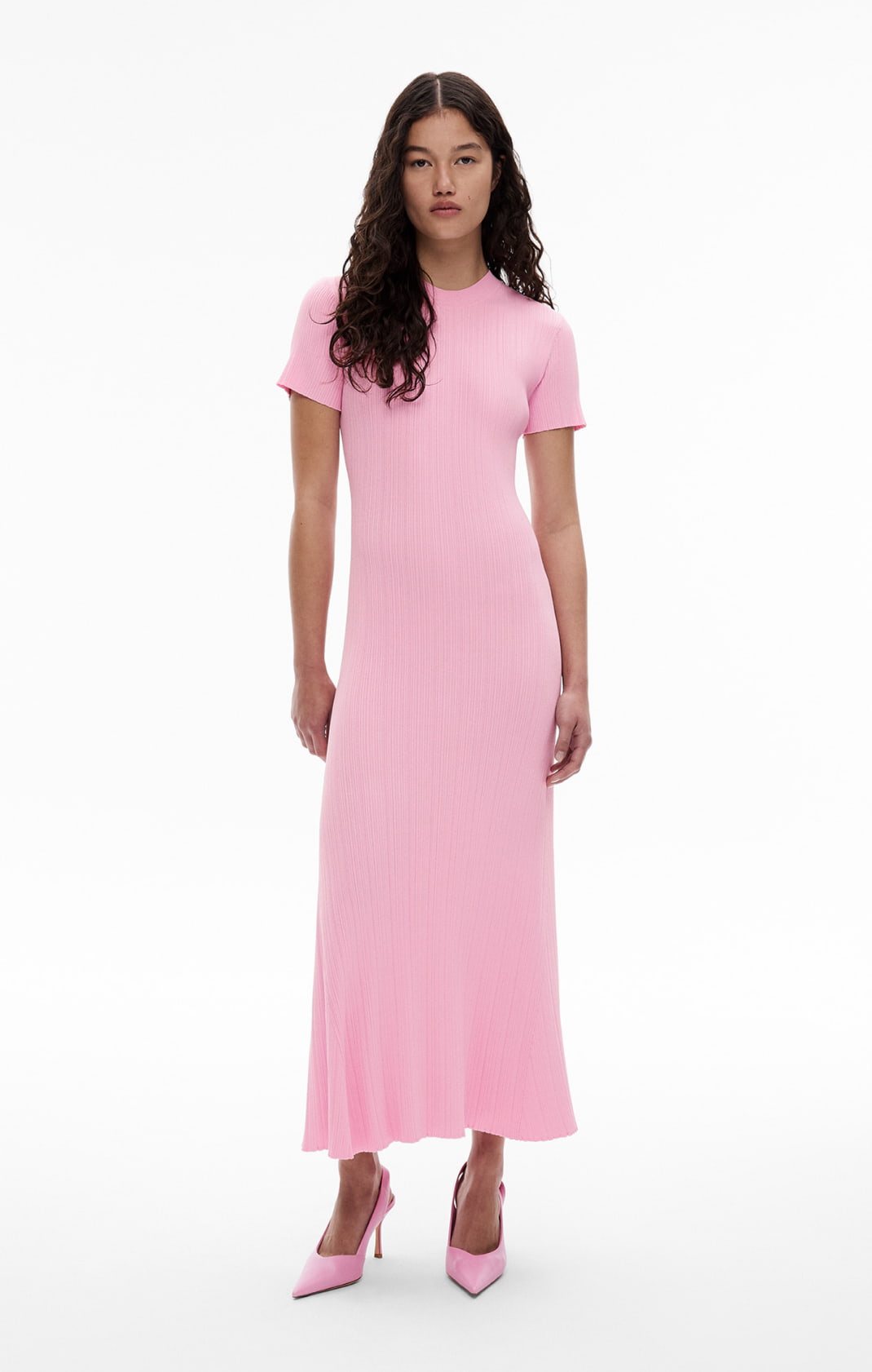 Woman weairng the pink variegated short sleeve knit dress and pink adriana heel